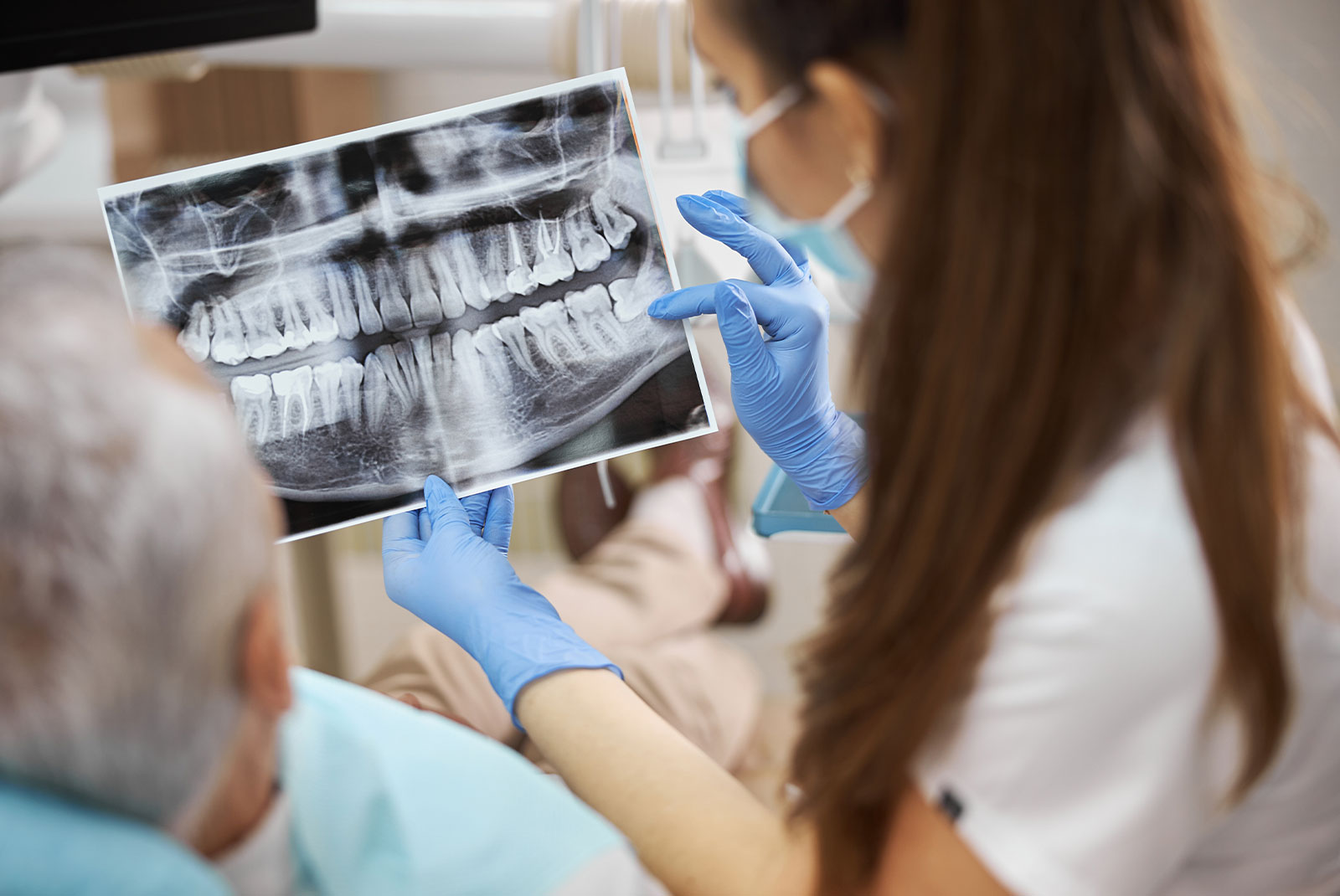 staff member going over dental procedure information with patient