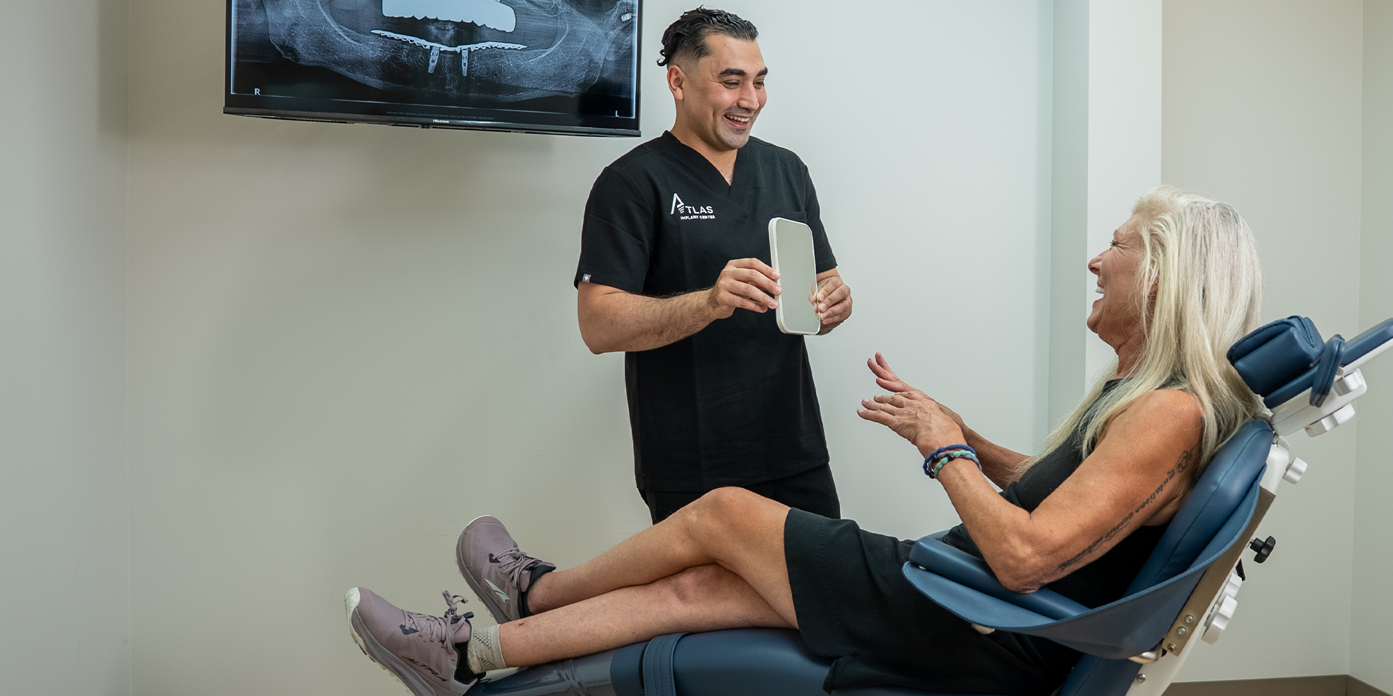 doctor showing results to dental patient for their procedure